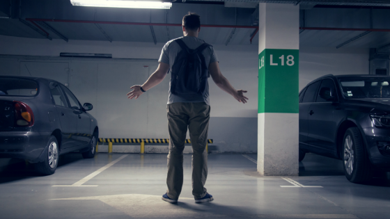 Male employee puts arms out in front of empty parking space where his vehicle and equipment should be.